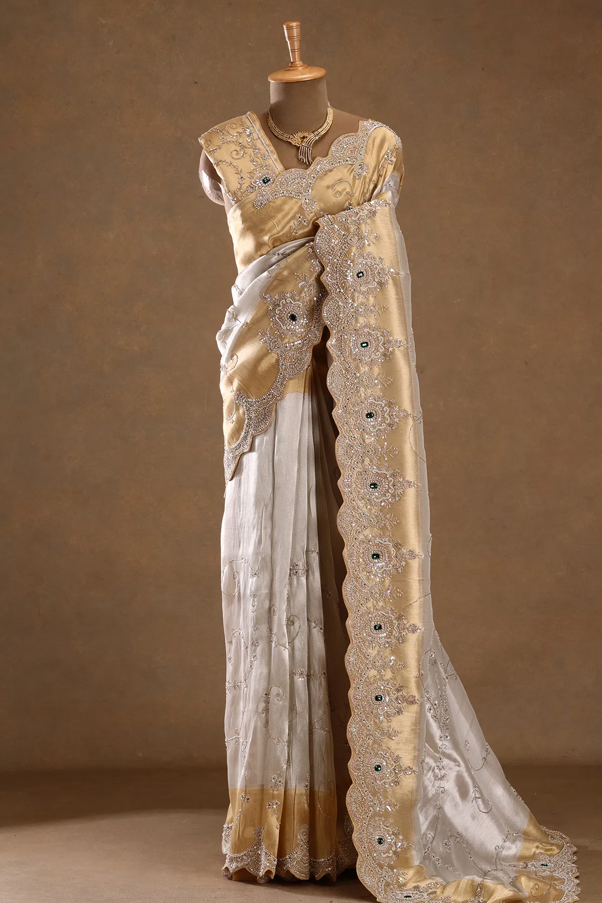 Cream bead embellished tissue designer saree